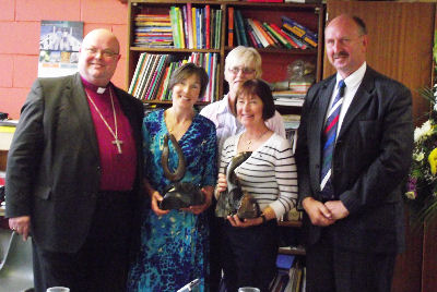 The Board of Management presents gifts to retiring teachers